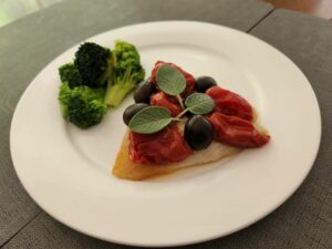 broiled sea bass w corbarino tomatoes and olives